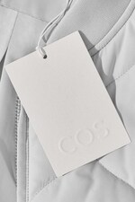 Placeholder for: COS clothing tag