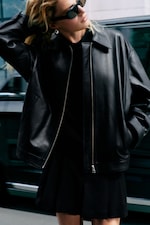 Placeholder for: Women wearing a black leather jacket and black skirt