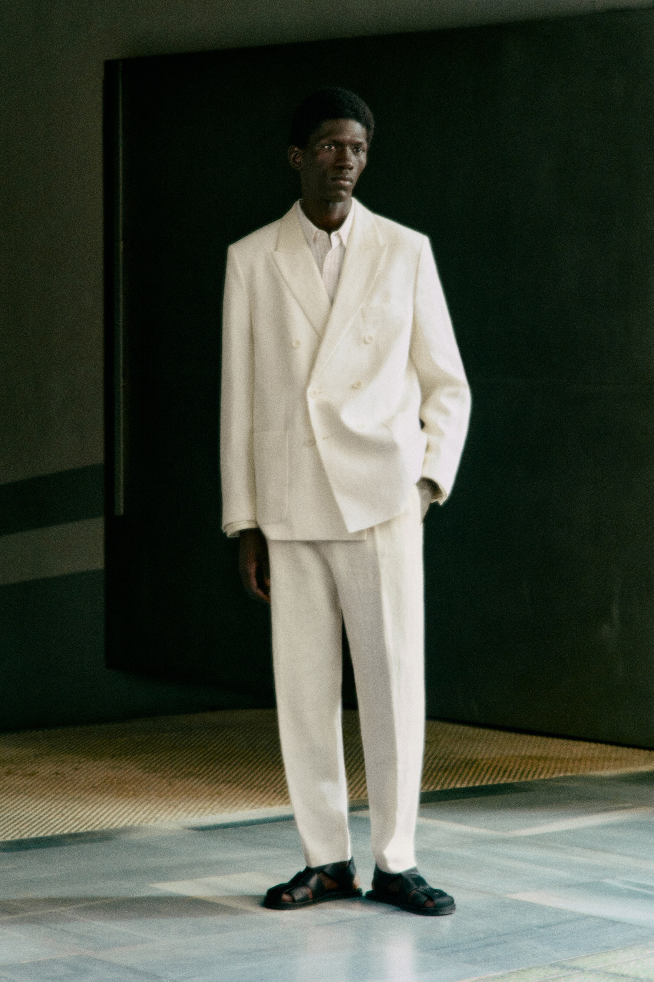 Man wearing white linen suit