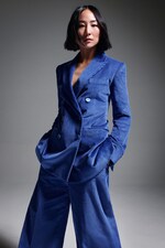 Placeholder for: Greta Lee wears suit by COS