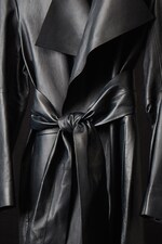 Placeholder for: Close up image of COS leather trench coat