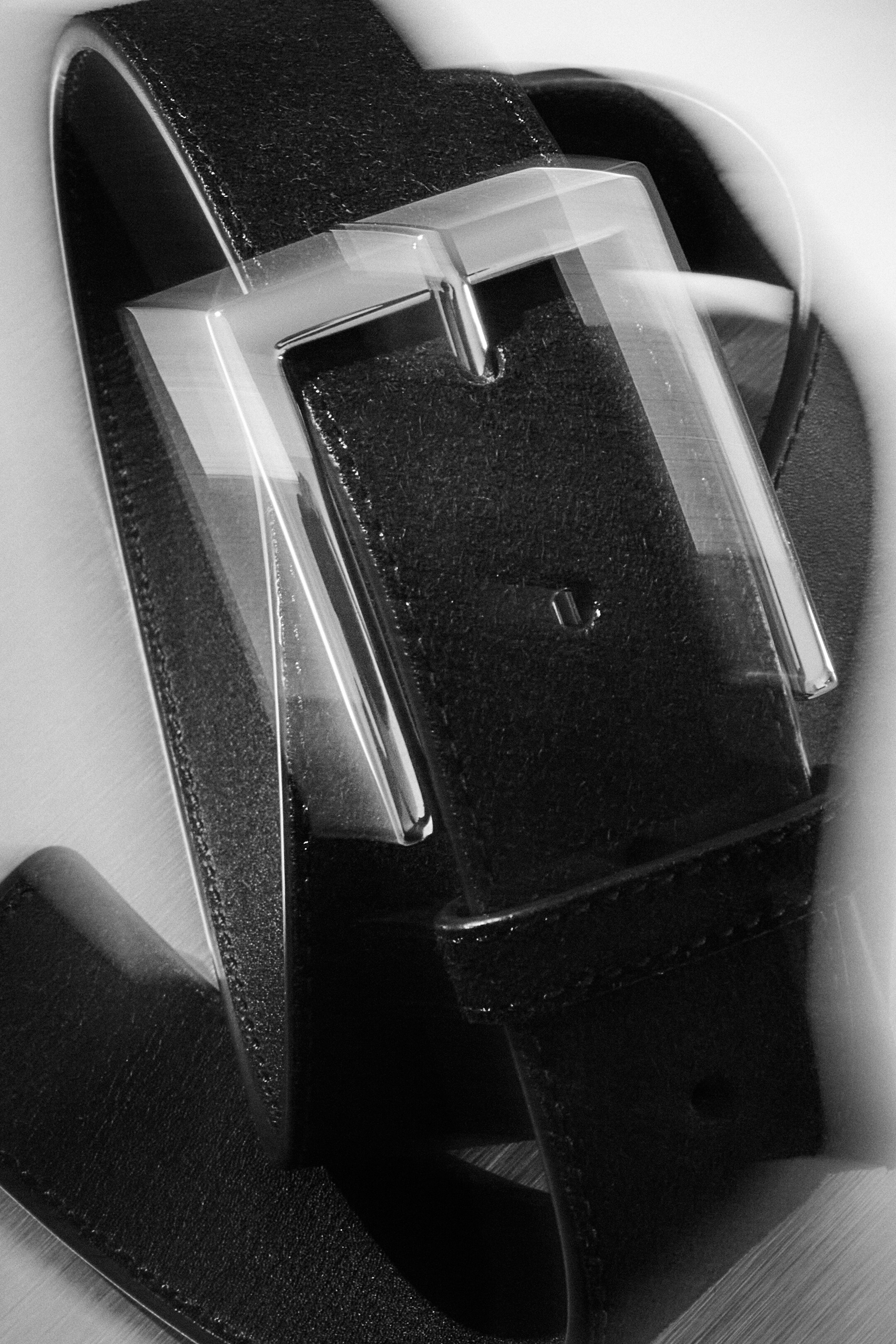 Black and white close up image of a belt