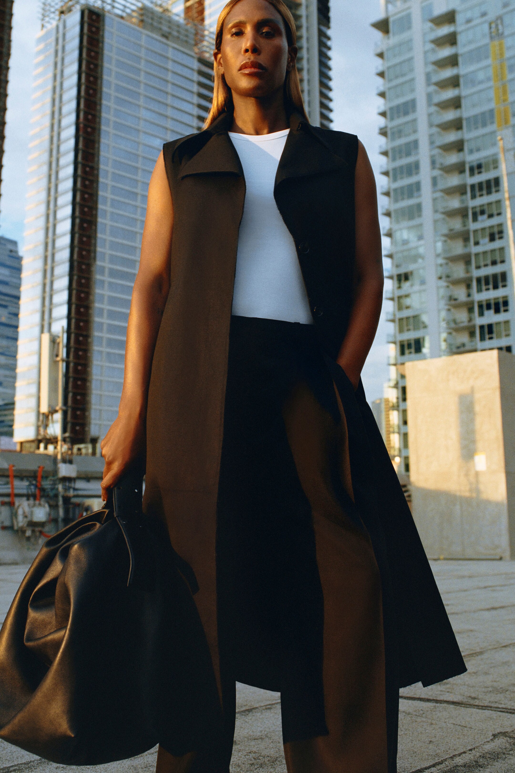 Person wearing brown long vest