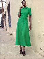 Placeholder for: Sheila Atim wearing green dress and black shoes