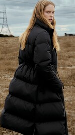 Placeholder for: Woman wearing puffer coat