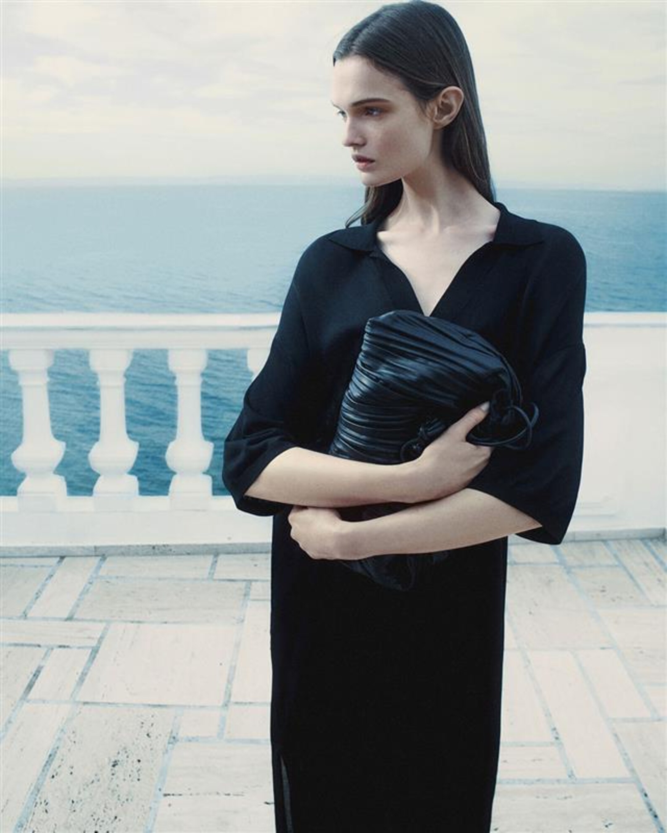 woman in black dress and bag