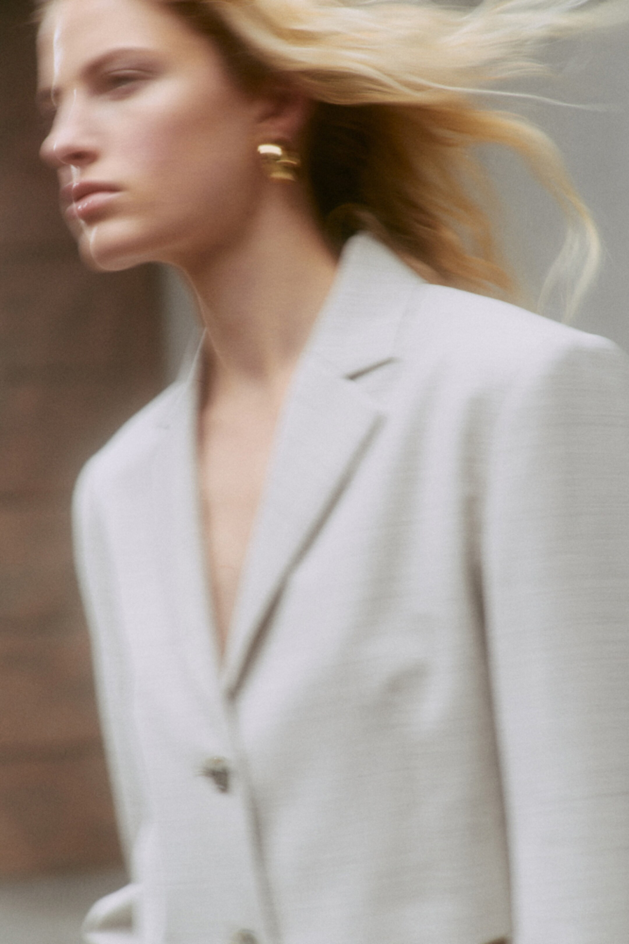 woman wearing white blazer