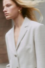 Placeholder for: woman wearing white blazer