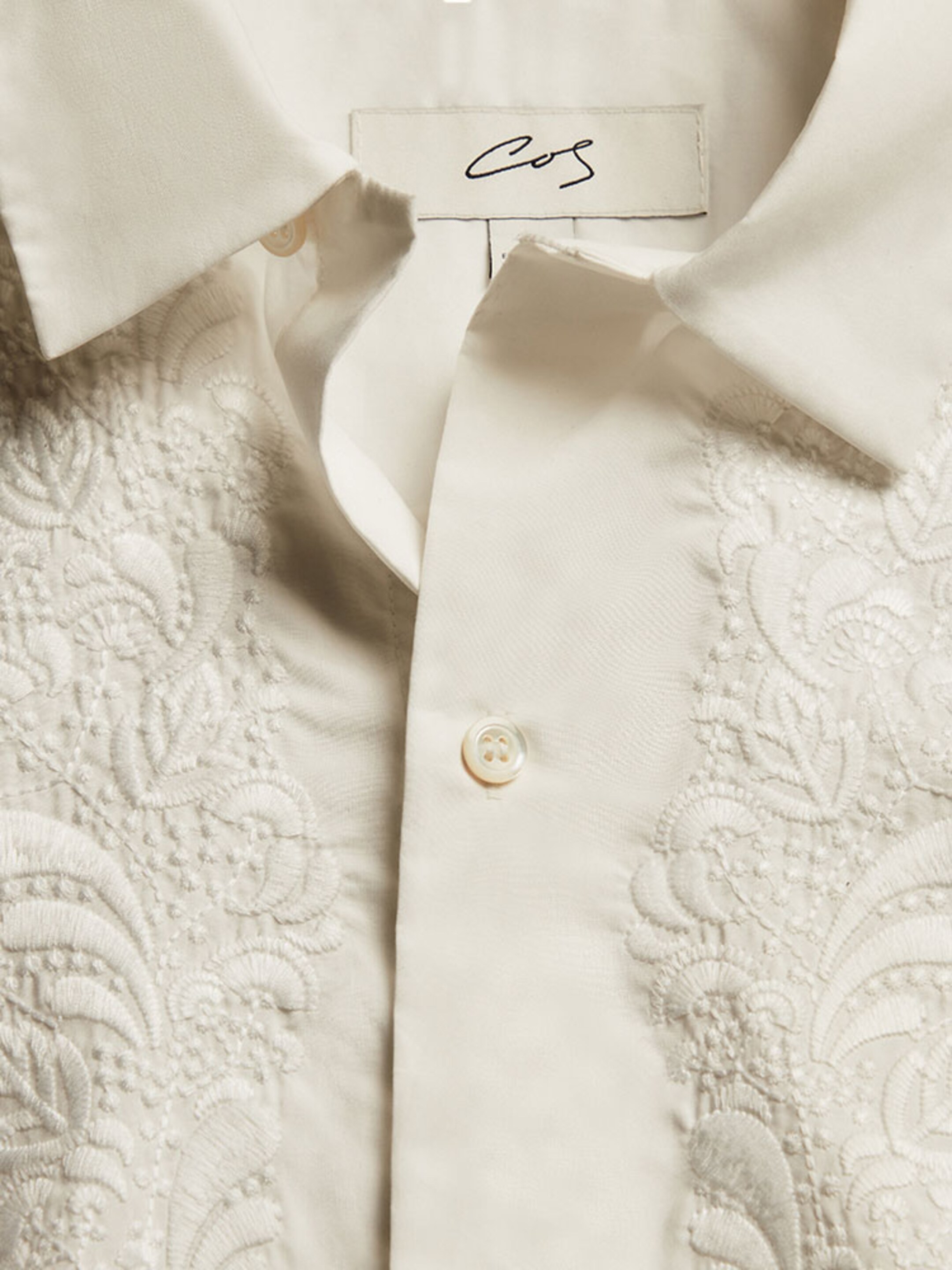 White collared shirt with embroidery detail