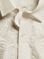 Placeholder for: White collared shirt with embroidery detail