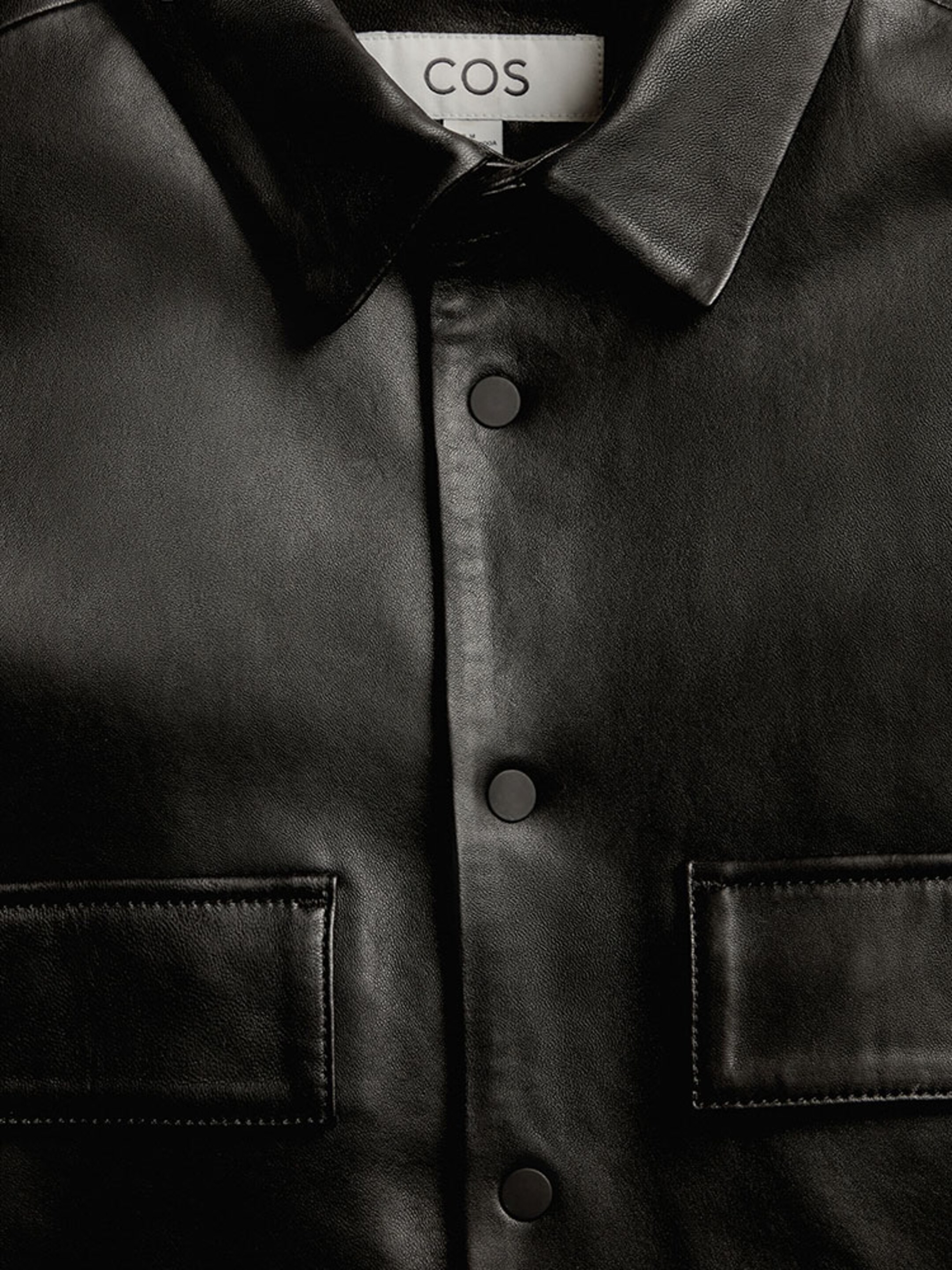 Black leather collared shirt with chest pockets