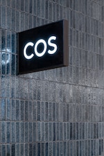 Placeholder for: COS store logo on recycled ceramic tiled wall