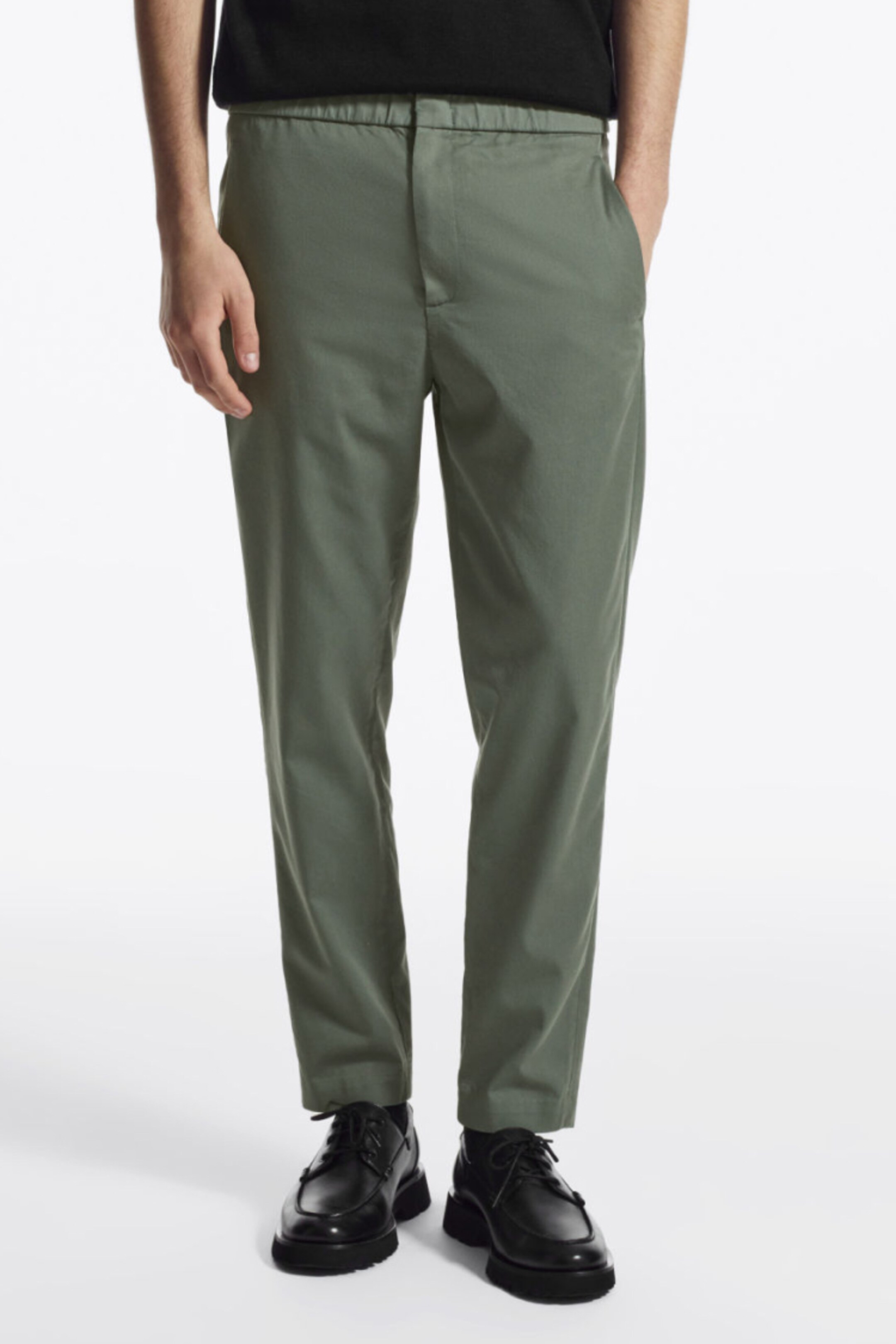 Person wearing green trousers