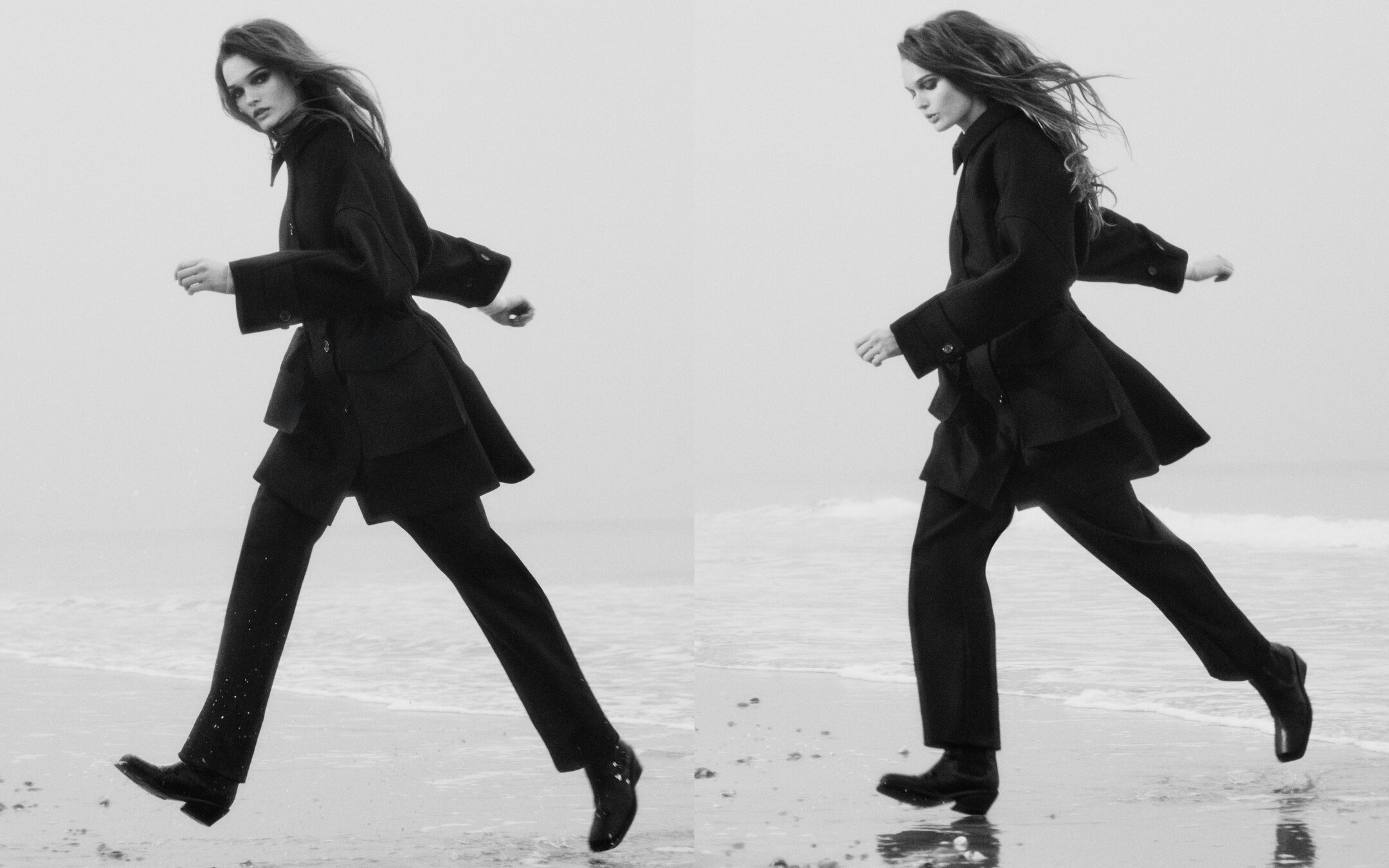 person on a beach wearing black coat