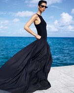 Placeholder for: Person wearing maxi black sleeveless dress and sunglasses